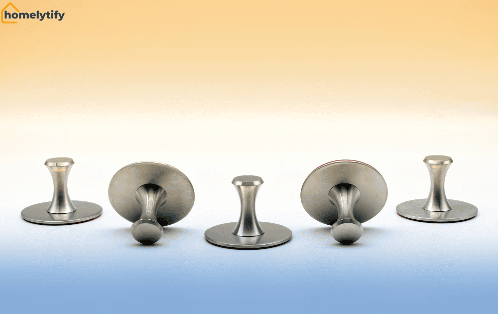 Five silver metal adhesive hooks displayed front and back views against a gradient background for wall storage 