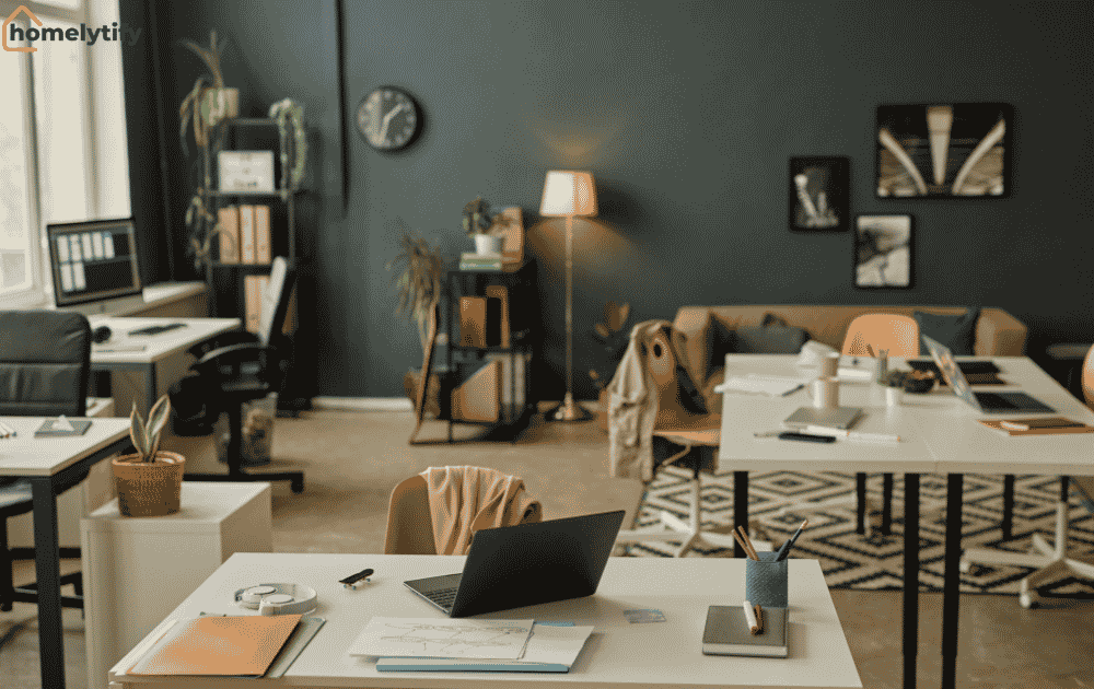 A cluttered rental space with papers, laptops, and items scattered across desks, showing how clutter builds up faster in rental spaces 