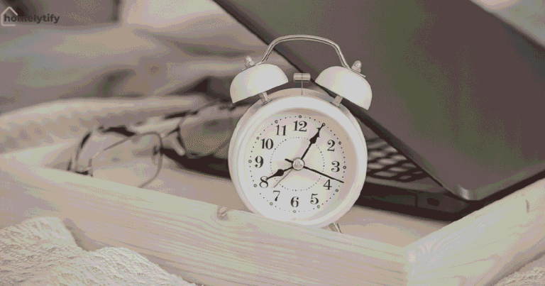 Morning routine ideas with an alarm clock showing 8:40, glasses, and a laptop on a wooden tray in a cozy bedroom setting.