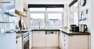 Organize a Small Kitchen with smart cabinet storage, clean countertops, stainless steel appliances, and bright natural lighting in a compact modern kitchen.