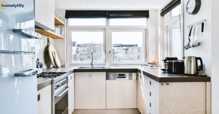 Organize a Small Kitchen with smart cabinet storage, clean countertops, stainless steel appliances, and bright natural lighting in a compact modern kitchen.