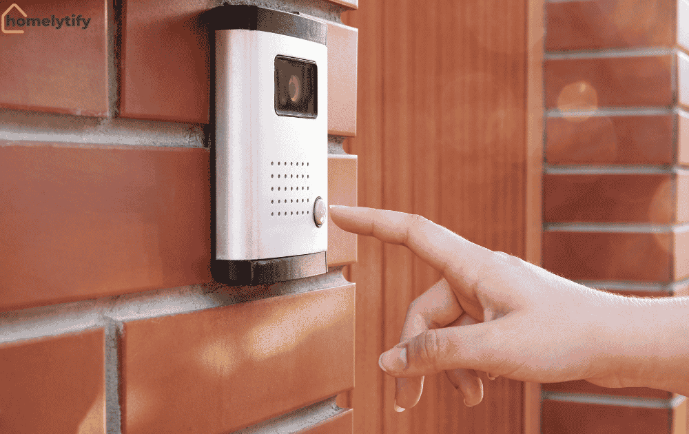 A person pressing a smart doorbell's camera button mounted beside a front door for secure and convenient home entry monitoring.