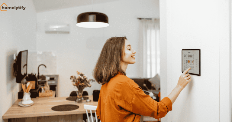 A woman using a smart home device control panel in a modern kitchen to manage lighting and home automation settings.