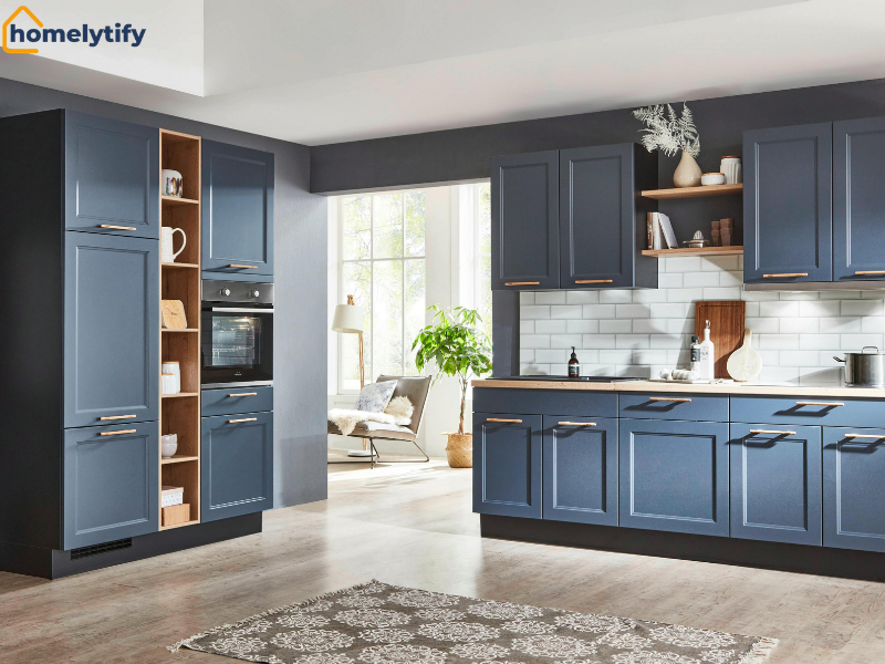 Above kitchen cabinets styled with decorative vases and open shelving in a modern blue kitchen