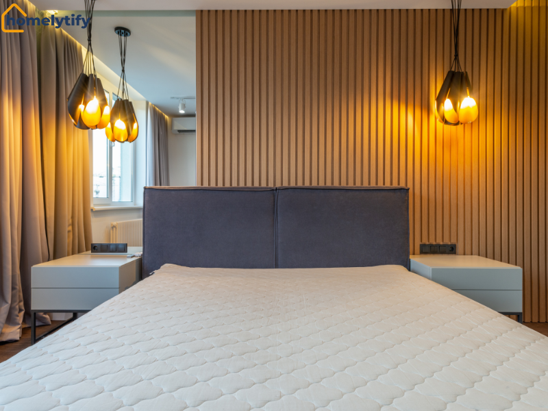 Modern bedroom with warm pendant lights dimmed low, creating a calm and cozy atmosphere for better sleep