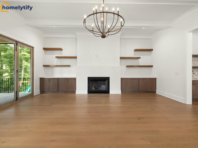 Floating shelves flanking a fireplace with built-in cabinets in a bright, modern living room