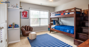Organization systems for small kids' bedrooms featuring a bunk bed with built-in stair drawers, floating shelves, and sports-themed decor. 
