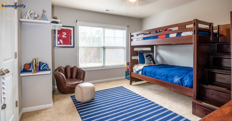 Organization systems for small kids' bedrooms featuring a bunk bed with built-in stair drawers, floating shelves, and sports-themed decor. 
