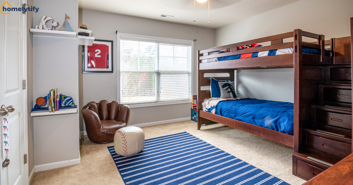 Organization systems for small kids' bedrooms featuring a bunk bed with built-in stair drawers, floating shelves, and sports-themed decor. 