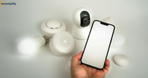 Person holding a phone alongside smart bulbs and smart home gadgets while troubleshooting smart bulb WiFi setup problems