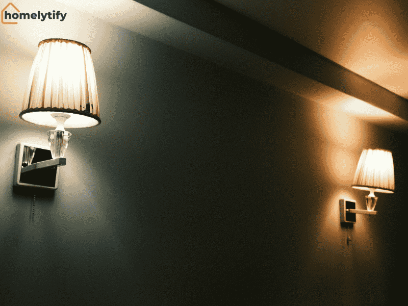Two warm-toned wall sconces illuminate a modern interior with smart lighting systems for ambient home decor 