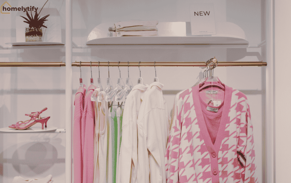 A styled clothing rack with upper shelves and side displays showing how to use vertical space for organised small room storage.