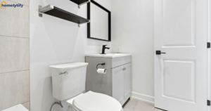 How to organize a bathroom with no cabinets using a floating shelf and vanity storage