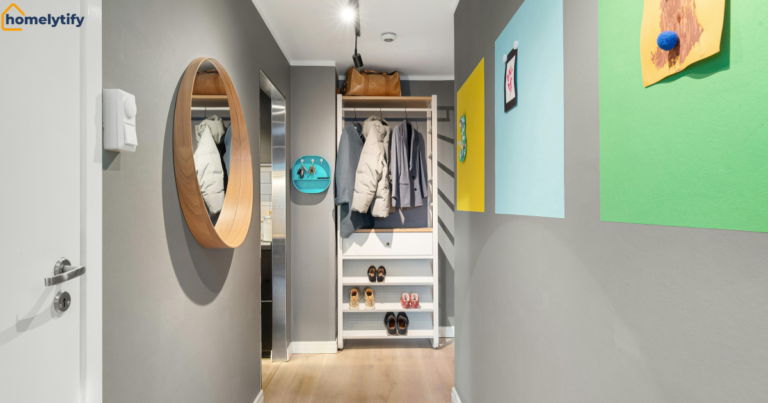 How to organize a small entryway for shoes and coats using a hallway shelf unit with hanging coats and shoe rack.
