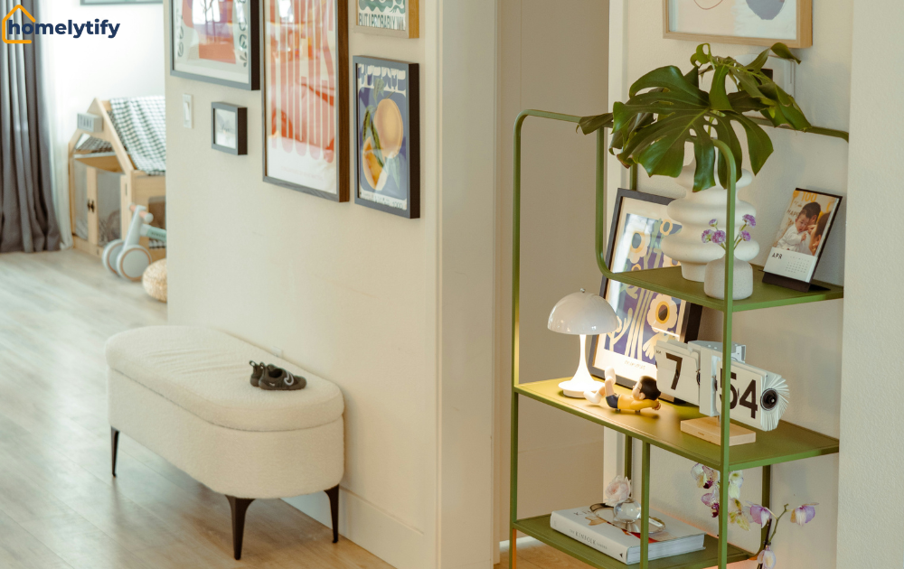 Organize a small entryway with a cushioned bench, gallery wall art, and a green tiered shelf for decor storage